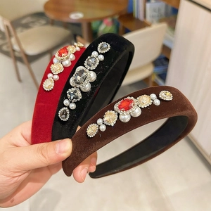 Detail of luxury velvet headbands with inlaid crystals, pearls and vintage gemstones
