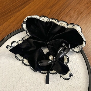 Elegant black velvet hair scrunchie with white lace trim, ribbon bow and pearl pendant