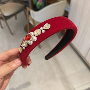 Detail shot of vintage burgundy velvet headband with pearls and square gemstones