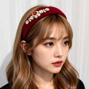 Vintage red velvet padded headband with crystal floral accents and pearls on model