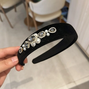 Detail of black velvet headband with elegant pearls and grey square rhinestones