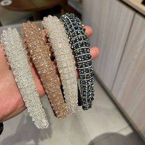 Close-up of luxury padded headbands with sparkling crystal beads in four elegant colors