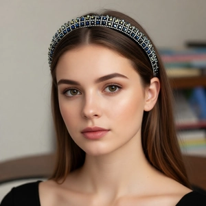 Detailed close-up of luxurious wide headband with colorful crystals worn by a model