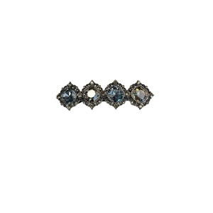 Vintage silver hair clip with multi-faceted crystals and rhinestones on white background