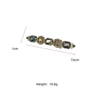 Detail showing vintage gold hair clip with crystal inlay and 7.6cm length measurement