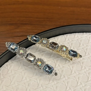 Vintage style hair clips with sparkling crystals and metal floral design in gold and silver