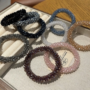 Sparkling crystal bead hair ties in 8 assorted colors displayed in a beige jewelry box