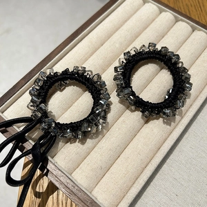 Elegant Korean square crystal hair ties with black satin ribbon on jewelry tray