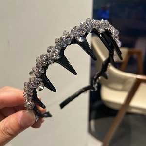 Detail view of crystal beaded headband with non-slip comb teeth for volume