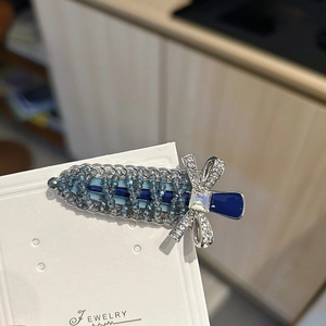 Elegant Korean style side hair clip with blue crystal beads and bowknot detail