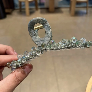 Sparkling crystal large hair claw clip with grey fabric wrap and elegant rhinestones