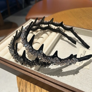 Punk style spiked headband with sparkling crystals for high-volume hair styling