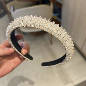 Close-up of luxury thick headband with handmade crystal rhinestones for formal events