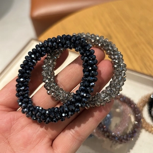 Detail of beaded hair ties with faceted crystals and high elasticity elastic core