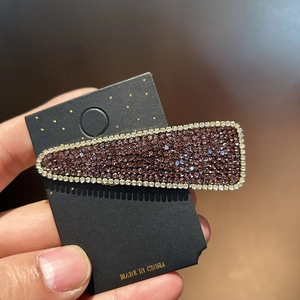Sparkling dark purple rhinestone hairpin with white crystal border on display card