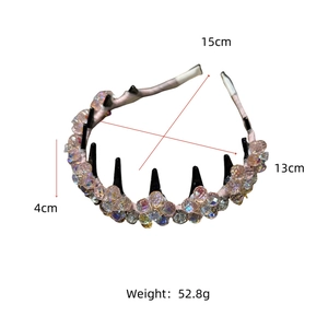 Detailed view of handmade crystal flower headband with pink woven fabric and beaded design