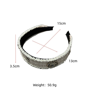 Detail showing white tweed headband with pearls and rhinestones measuring 15cm by 13cm