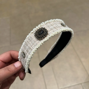 Elegant tweed headband with white faux pearls and dark gemstone accents for women
