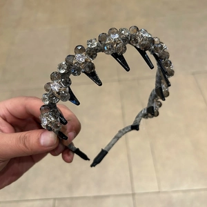Detail of handcrafted crystal bead headband with non-slip teeth and woven grey stones