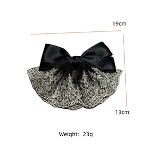 Detail view of the black satin bow hair clip with silver lace and 19cm size marking