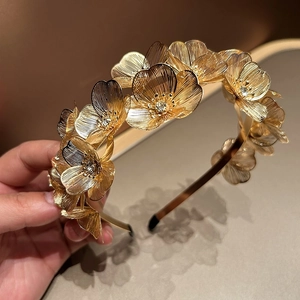 Elegant gold ginkgo leaf headband with sparkling rhinestones for bridal hair decoration