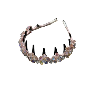 Pink handmade crystal headband with black inner comb teeth for elegant hair styling