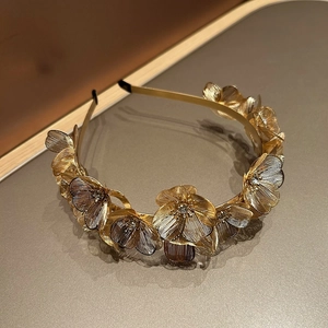 Elegant gold ginkgo leaf headband with sparkling rhinestones and delicate metal mesh petals