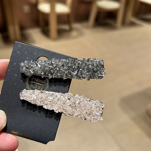 Sparkling Korean rhinestone hair clips in silver and champagne on a display card