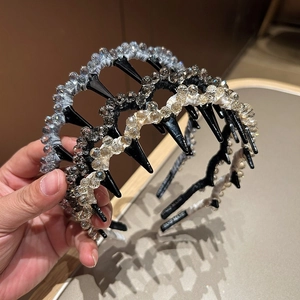 Eleganti cerchietti di cristallo con denti nei colori nero, champagne e argento