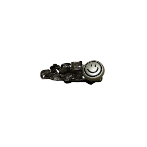 Sparkly silver rhinestones hair clip featuring a classic black smiley face charm