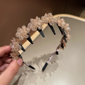Detailed macro of the handmade crystal flower headband with small securing hair clips