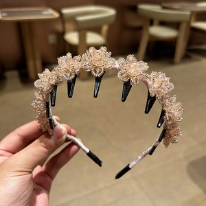 Elegant champagne gold crystal flower headband with integrated inner hair clips for styling