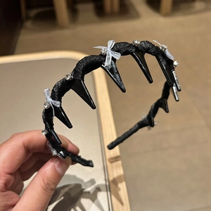 Black non-slip headband with teeth featuring mesh bows and rhinestones for women