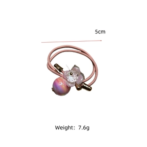 Detail of pink crystal beaded hair tie with 5cm diameter and 7.6g lightweight design