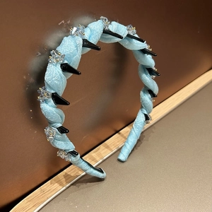 Light blue mesh fabric headband with crystal accents and black grip teeth for women