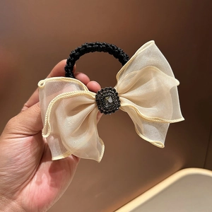 Elegant beige mesh bow hair tie with crystal rhinestone centerpiece and elastic band
