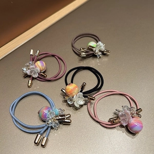 Five-piece set of crystal cut bead hair ties in pastel colors with gold accents