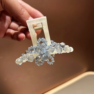 Elegant medium square claw clip with sparkling crystals and beige base for hairstyles