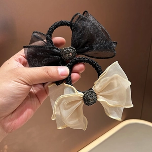 Set of mesh bow hair ties in black and champagne gold with vintage rhinestone centers