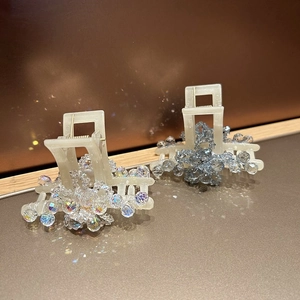 Sparkling crystal hair claw clips in iridescent clear and light blue on resin base