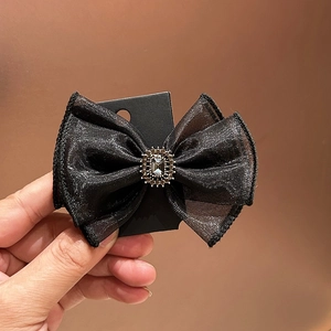Elegant black organza bow hair clip with a vintage rhinestone centerpiece for women