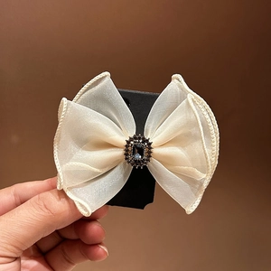 Elegant organza bow hair clip with vintage blue gemstone and scalloped edges for women