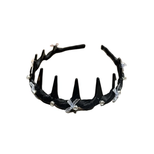 Elegant black headband with teeth and silver silk bows featuring sparkly rhinestones