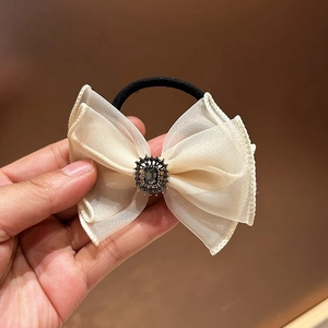 Elegant cream organza bow hair tie with vintage dark grey gemstone and rhinestones