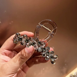 Brown resin hair claw clip with sparkling multifaceted beads and gold metal spring