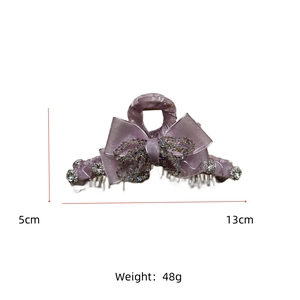 Macro detail of lavender crystal bow hair claw clip showing 13cm length and 5cm height