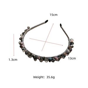 Detailed view of handmade beaded headband with size markings 15cm and 13cm in height