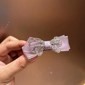 Elegant purple crystal bow hair claw clip with satin ribbon and sparkling rhinestones