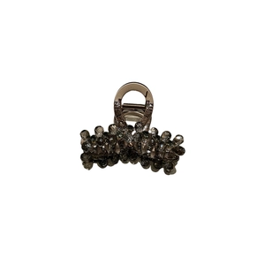 Elegant medium hair claw clip with smoke gray crystals and metallic frame on white back
