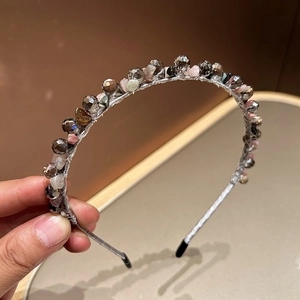 Handmade beaded headband with brown crystal and pink stone on silver wire base